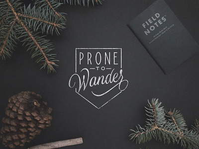 Prone to Wander badge flatlay hand lettering lettering logo logotype script