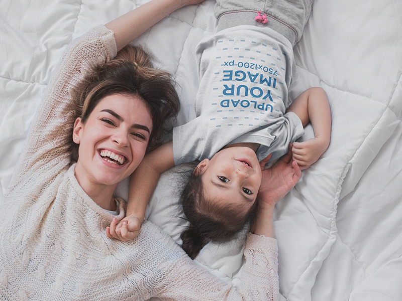 Happy Girl Wearing A T Shirt Mockup With Her Mom On Bed apparel mockup graphic tee t shirt t shirt design t shirt mockup