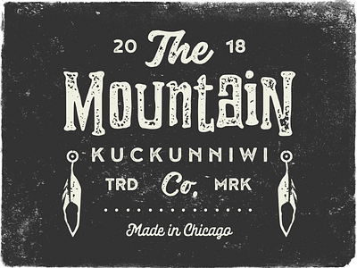 Kuckunniwi feather grain grit gritty grunge logo mountain native native american outdoors retro type typography vector vintage