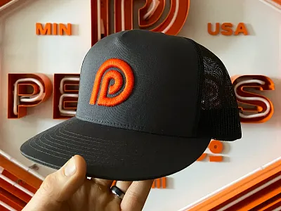 Peters Design Company Hat and Branding american badges brand branding classic crest custom design font hat logo logos minneapolis neon orange p pattern sign signage typography