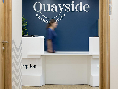 Reception - Quayside Orthodontics brand identity design branding dental branding dentist dentist branding interior interior design logo logo design reception signage waves