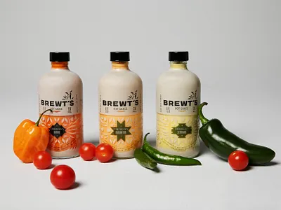 BREWT'S Hot Sauces art direction bottle branding chihuahua design dog dog logo food full circle hispanic hot sauce logo logo design packaging packaging design pattern peppers rebrand spicy