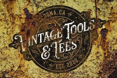 Vintage Tools & Tees logo on rusty panel branding decay design font logo painting rust typography vintage vintage logo weathered yellow