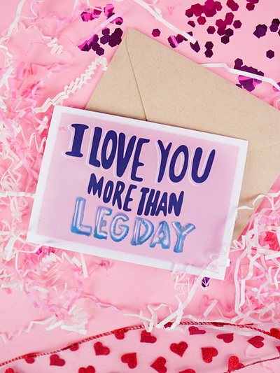 Hand Lettered Greeting Card "I Love You More than Leg Day" balloon letters balloons branding flat lay graphicdesign greeting card greeting card design greeting card mockup greeting cards hand drawn hand lettered hand type hand typography illustration leg day love lover photography valentinesday weightlifting