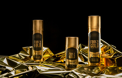 Fools Gold alchemy art direction black and gold branding can concept conceptual design gold gold foil gold logo golden graphic design magic package design packaging packaging design spoof spray spray can