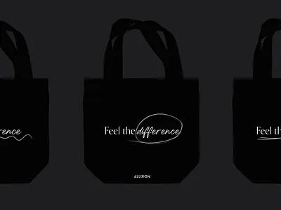 Black tote bag with a strong message aluxion brand brand identity branding branding design catchphrase claim concept design hand drawn illustration merch design merchandise merchandise design minimal offset spanish tote bag typography