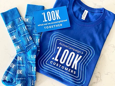 100K Customer employee swag pack animation apparel branding celebration employee gift knit logo milestone pattern print pulse repeating pattern shirt socks swag wearables