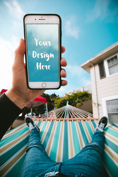 iPhone in the Hand of a Guy in a Hammock [PSD Mockup] 7 plus 8 plus apple free download free mockup free psd freebie hand hand holding iphone mock up mockup mockup free mockup psd summer