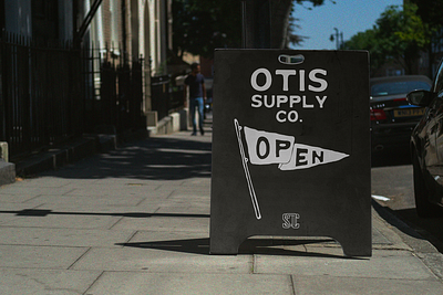 Otis Supply Co. Sandwich Sign badge design branding clothing store design illustration logo minimal neutral outdoor sign typography