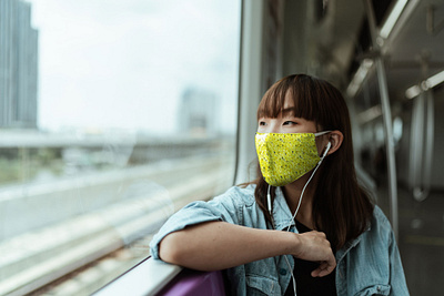 Mask Mockup With Young Woman in Train [Free PSD Mockup] anti pollution apparel cloth mask dust protection face mask facemask free download free mockup free psd freebie mask medical mask mockup psd mockup woman
