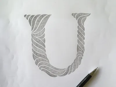 U flourishes lettering script