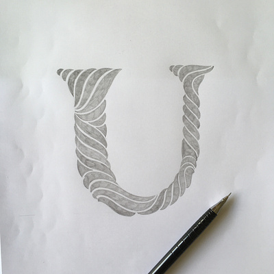 U flourishes lettering script