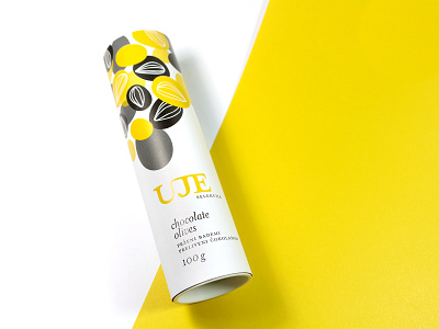 Chocolate coated almonds packaging almonds chocolate chocolate packaging package design packaging packaging design pattern print tube yellow