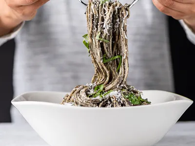 Food Styling Black Pasta for Royal Prestige Magazine basil black black and white black pasta cheese corn smut editorial foodie model parmesan pasta photography prop styling