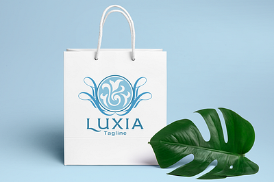 Luxia - Feminine Logo beauty logo beauty product boutique logo brand design branding cosmetic elegant feminine logo flourishes label logo design luxury brand luxury logo ornament