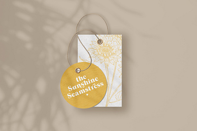 The Sunshine Seamstress Garment Tag brand design brand identity brand strategy branding design garment tag seamstress sunflower logo