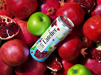 L'ATELIER — CARBONATED BEVERAGE apples brand branding can carbonated drink design drink fruit juice label logo packaging packaging design pomegranates refreshing drink soda soft drink trademark