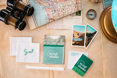 Scout Studio branding business card design embroidery flatlay green logo logotype maps paper photography scout stationary studio system travel typoography velum