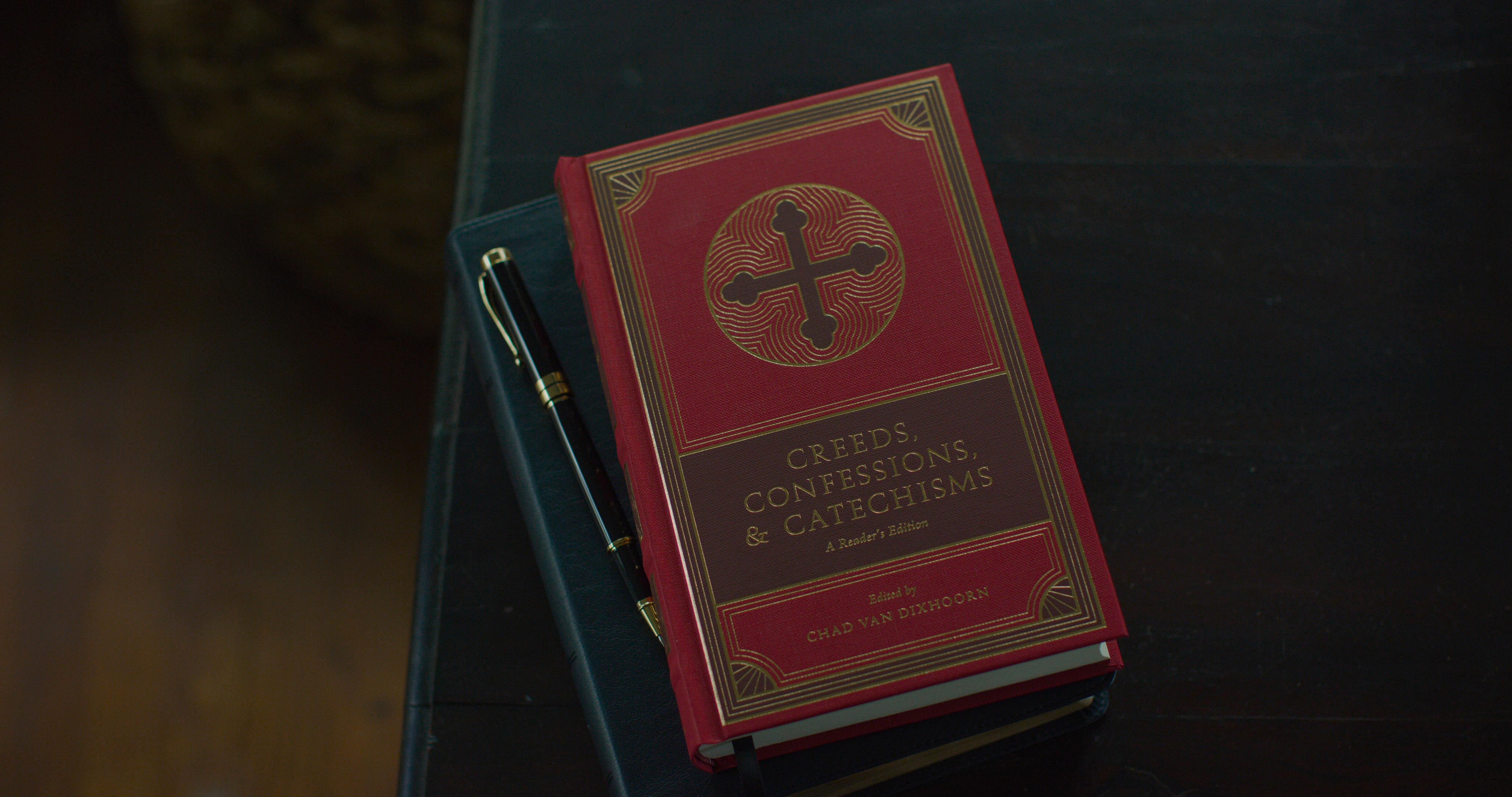 Creeds, Confessions, & Catechisms anthology book catechisms christian church confessions cover creeds cross design gold icon illustration jerusalem cross ornament red