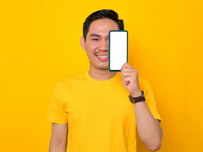 Excited Asian man on yellow background asian man casual confident fashion guy photography stock photos