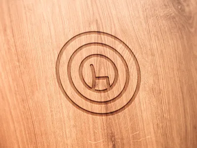 Engraved Symbol of a Chair Maker on a Wooden Chair chair chair maker engraved logo symbol wood