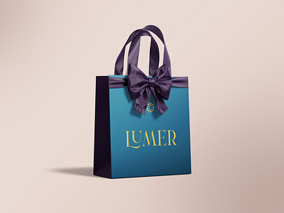 Lumer Branding bag brand clean cosmetics icon identity light logo lumer mark minerals moisture ocean rays sea shine sun symbol tone water