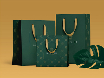 Shopping bag design for House of THL luxury modest fashion brand bag bag design brand design branding design elegant fashion gold graphic design green luxury packaging packaging design shopping bag