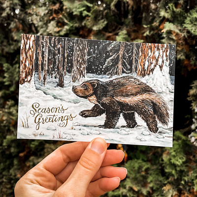 Wolverine in Wallowa Holiday Card adobe photoshop animal art conservation art endangered species gold foil gouache gulo gulo hand lettering holiday card ink nature neutral colors oregon art portland illustrator postcard art seasons greetings stationery watercolor wildlife art wolverine illustration