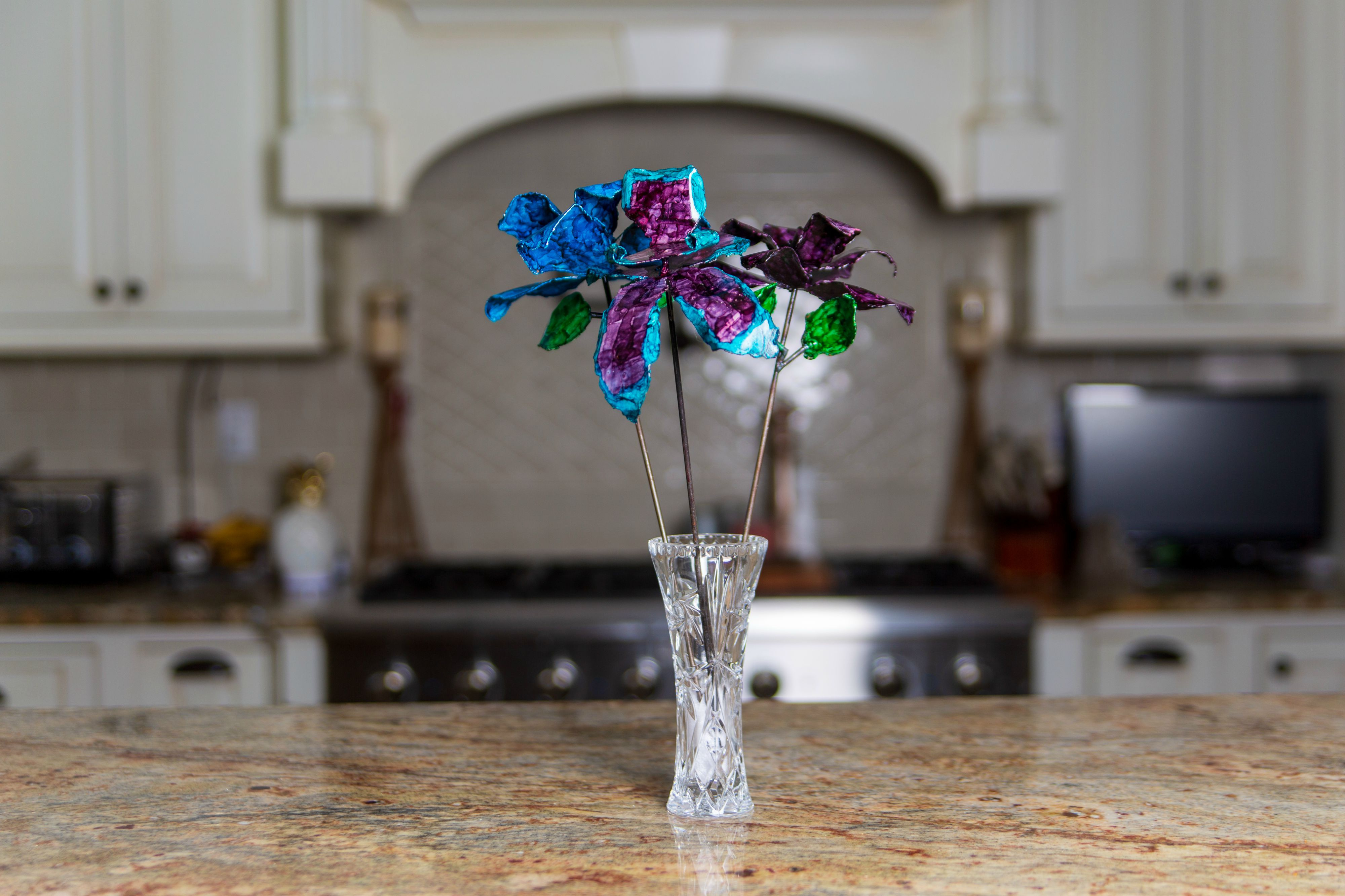 Example of Blue, Teal, Purple Recycled Steel Roses on Kitchen Counter View