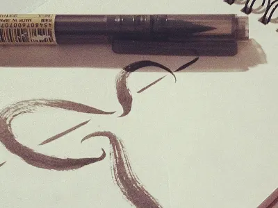 Working on an ampersand ampersand calligraphy lettering