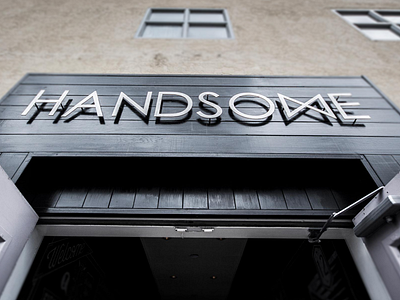 Handsome 5th street entrance handsome metal sign signage store front