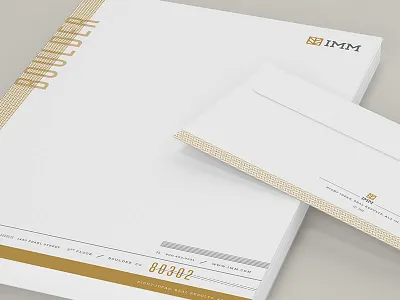 IMM Stationary branding envelope gold identity letterhead stationary