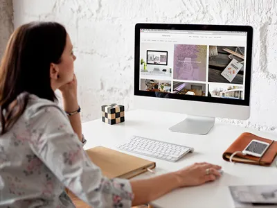 Woman using iMac - 12 photo mockups branding desk scene imac imac mockup mockup photo mockup scandinavian template white woman workplace workspace