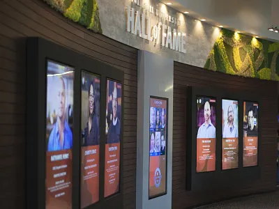 Hall of Fame Interactive Wall displays environmental design hall of fame interactive interior touchscreen video wall wall wood