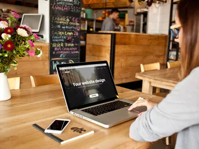 Working on MacBook Pro - 8 photo mockups cafeteria desk scene header image macbook mockup macbook pro mockup photo mockup psd web design wood workplace workspace