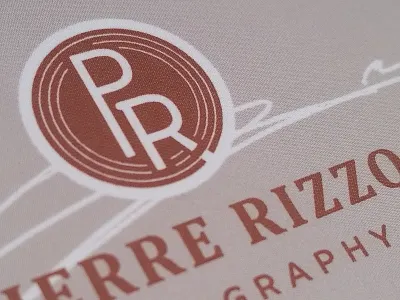 Pierre Rizzo Photography Logo beige brand brandmark emblem identity logo monogram photographer photography rust signature