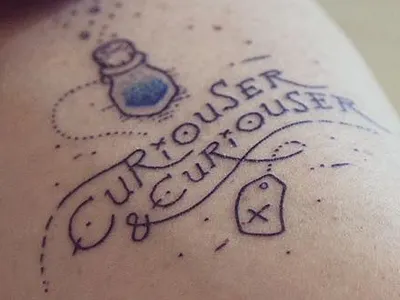 First Tattoo alice curious handdrawn ink tattoo type