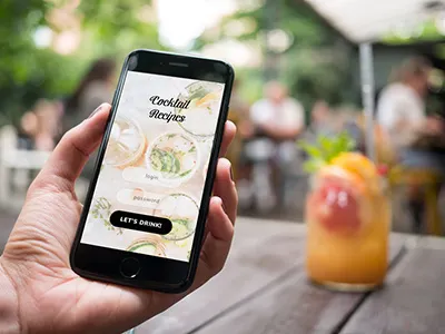 iPhone 7 at coffee garden - 12 photo mockups app design hands iphone 7 iphone mockup mobile mobile app mock up mockup photo mockup responsive