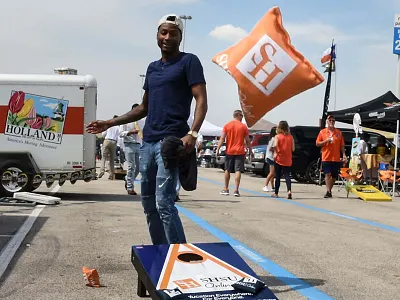 Tailgate Alley beanbag branding cornhole education football logo online pantone 021 sam houston shsu tailgate texas