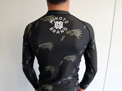 Wings of Victory Rash Guard - Back apparel design branding design illustration