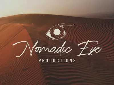 Nomadic Eye Productions Logo camera logo desert theme logo earthy logo eye drawing handwritten lettering nature logo photography logo videography logo