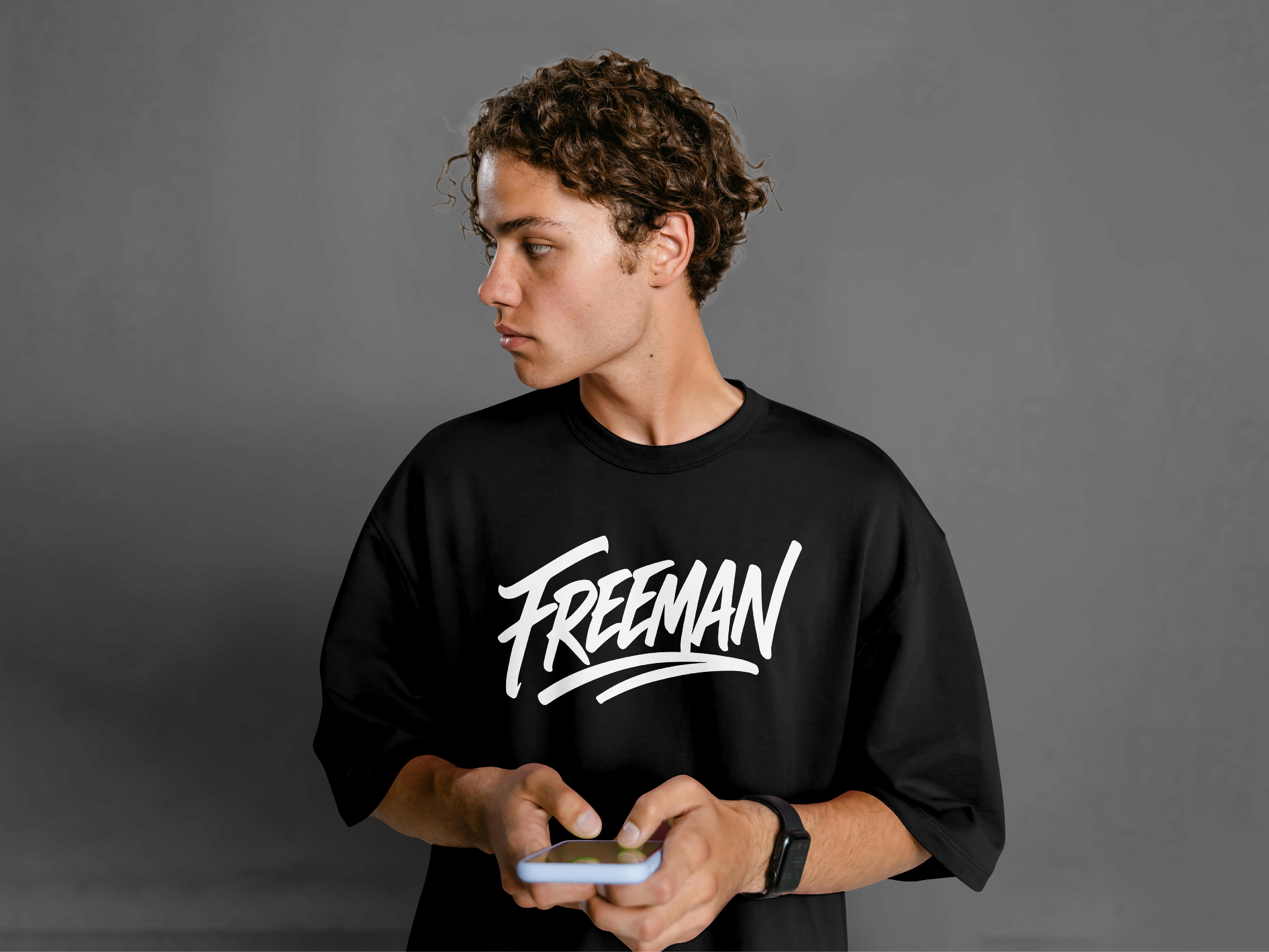 Freeman T-Shirt Logo Design abstract logos brand design brand identity brand identity design branding calligraphy design graphic design hand drawn logo hand written logo logo design logomark script logo t shirt design t shirt logo