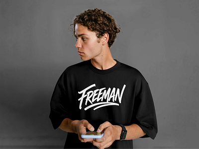 Freeman T-Shirt Logo Design abstract logos brand design brand identity brand identity design branding calligraphy design graphic design hand drawn logo hand written logo logo design logomark script logo t shirt design t shirt logo