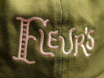 Fleur's Cap apparel brand branding embroidered embroidery hat lettering logo symbol type typography wordmark