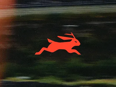 Jackelope Logo branding design fitness geometric graphic design green icon illustration jackelope logo mark rabbit red runner running training