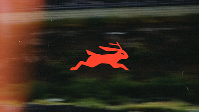 Jackelope Logo branding design fitness geometric graphic design green icon illustration jackelope logo mark rabbit red runner running training