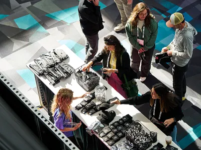 Accelerate25 - Swag apparel design event irl table