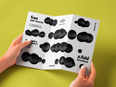 Free Hand Holding Folded Psd Brochure Mockup brochure mockup z fold mockup