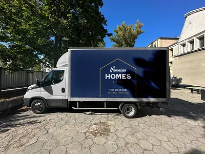Hammann Homes badge branding builder construction design dream home icon illustration logo stamp system texture truck type typography