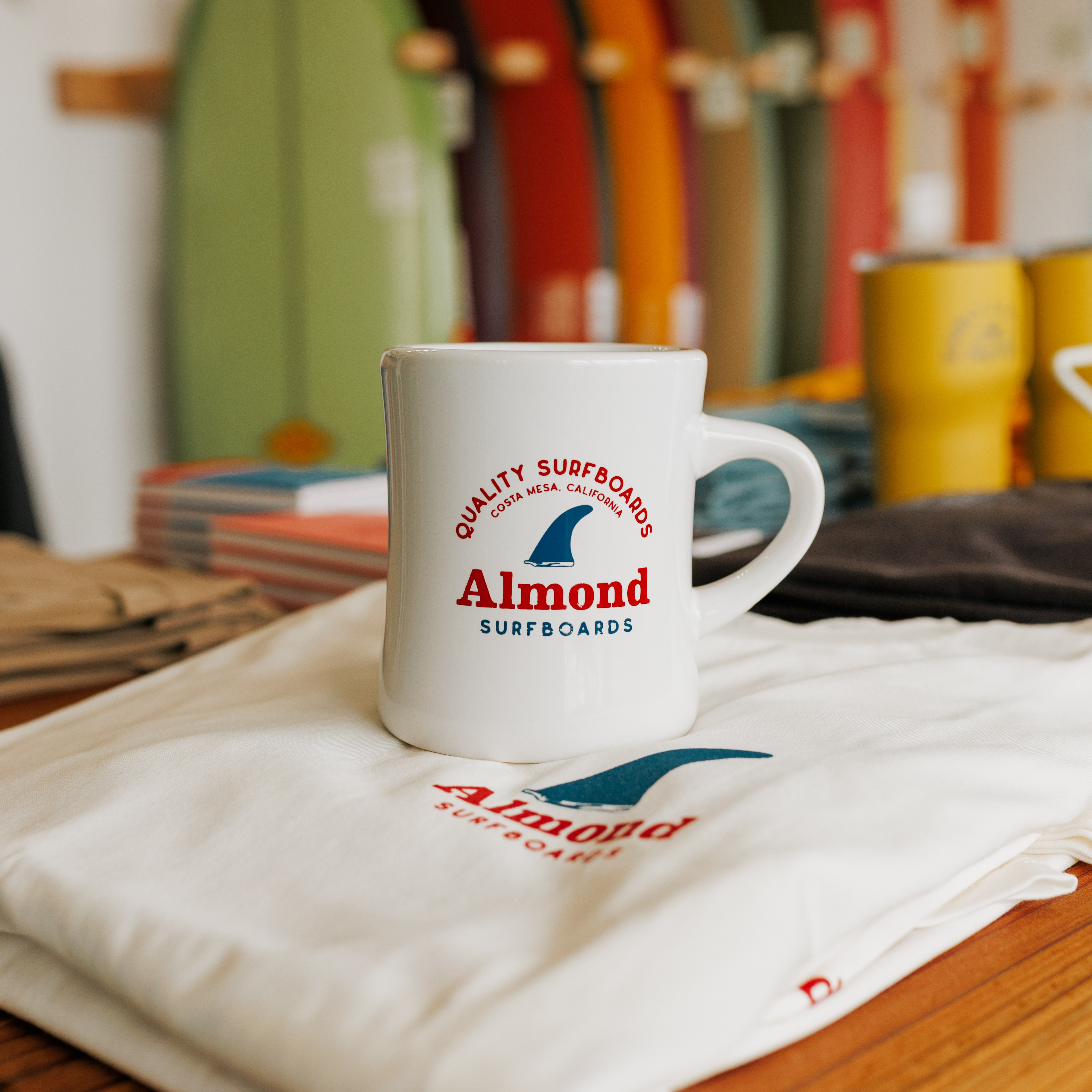 Almond Fin Mug & T-Shirt Design almond art direction design illustration mug print product shirt design surfboard surfboard fin tshirt typography vector